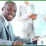 Strategic Leadership showing African American business leader at his desk, planning strategy.