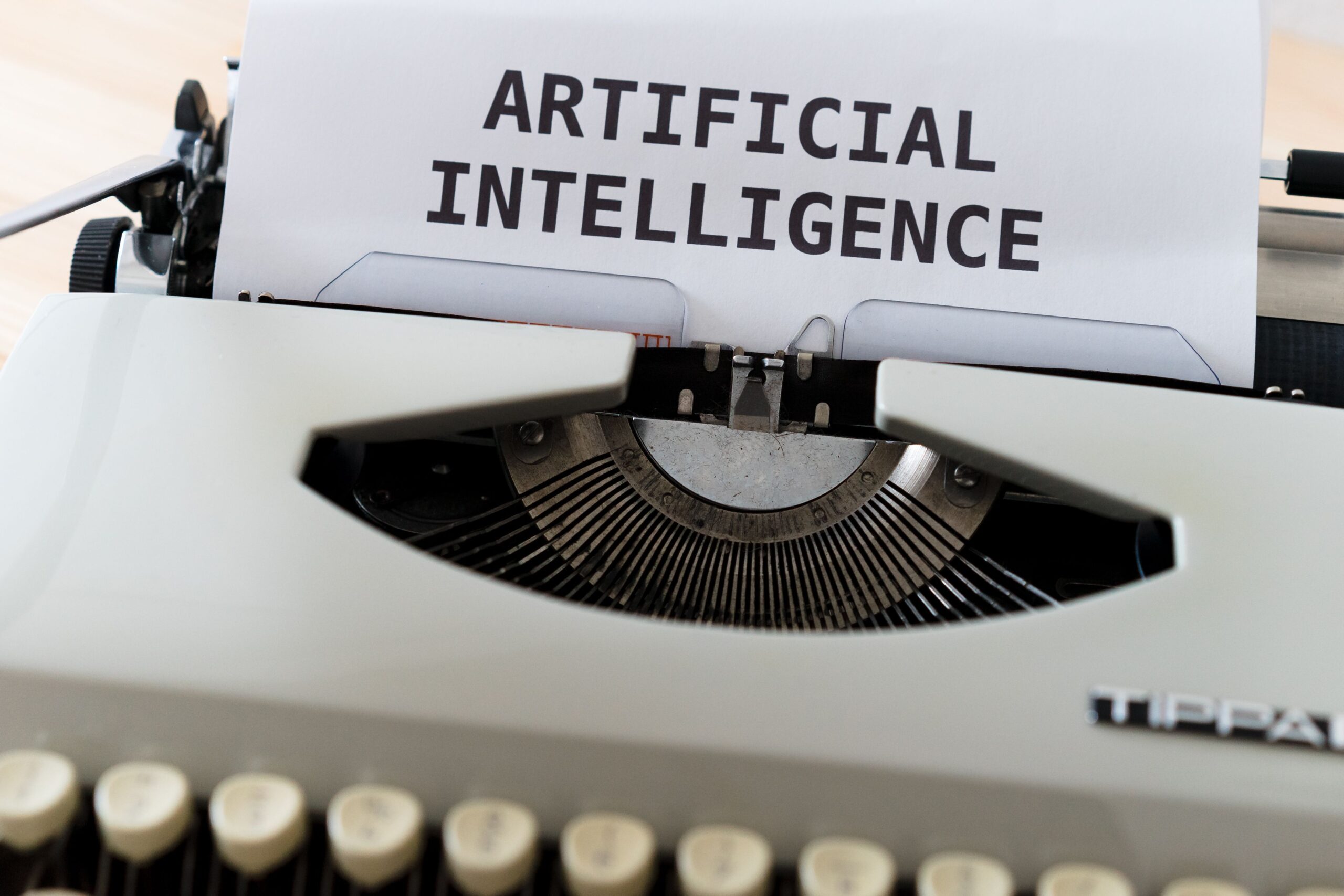 Image of computer screen with Artificial Intelligence written on it in big print.